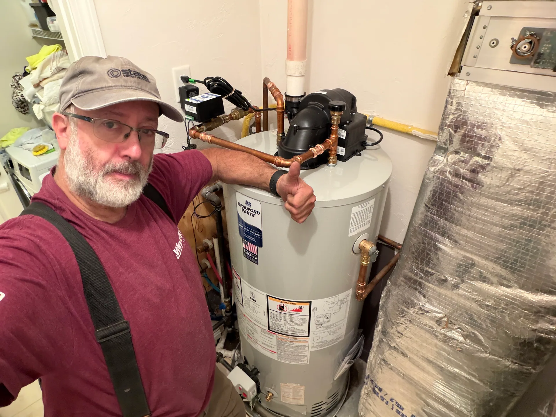 Technician thumbs up bradford white power vent water heater installation melrose