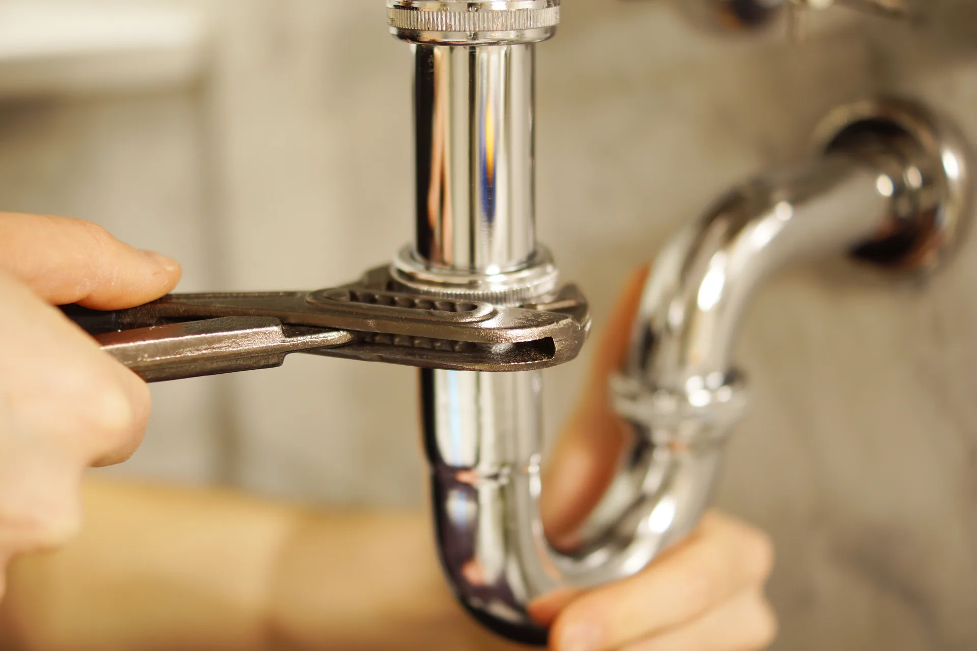 Bare hands tightening chrome p trap slip joint pliers melrose sink repair